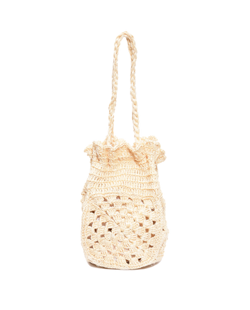 The Crochet Drawstring Bag by THE GREAT. SU23 is a beige, naturally dyed crochet handbag with two handles, showcasing a textured and patterned design using exquisite stitches.