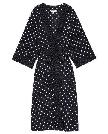 The Robe Black Mixed Polka Dot by THE GREAT. PS25 SLEEP, has wide sleeves and a matching sash belt for comfort, displayed on a white background.