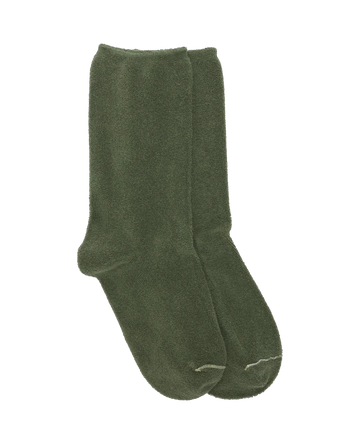A pair of army-colored, green socks with microterry texture from THE GREAT. SU23 MICROTERRY, offering a nod to 1970’s-inspired style.