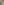 A woman in THE GREAT. SU25 The Bass Cardigan – Hot Red stands by a green folding chair with a bag and thermos, set against a mottled green backdrop.