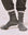 A person stands on a light-colored surface wearing black THE GREAT. SP25 SWEATSHIRT SOCKS, a cozy sweatshirt, and dark pants with elastic cuffs.